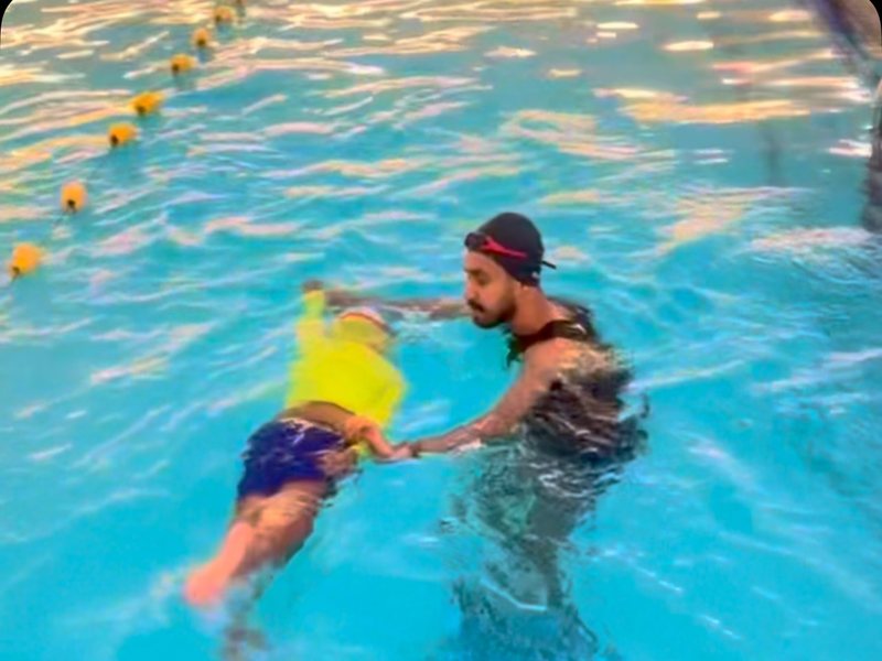Child learning to swim